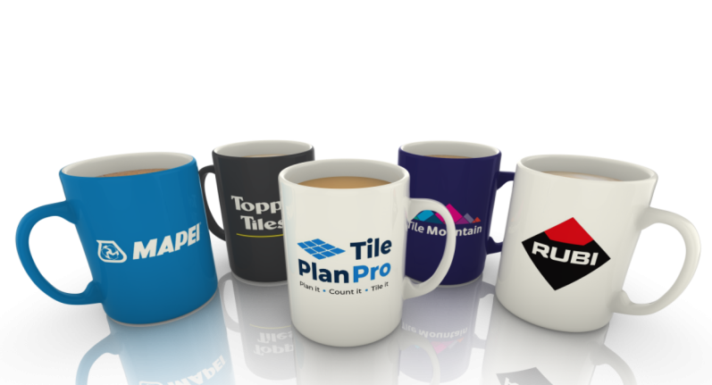 Five coffee mugs with various logos and designs, arranged in a group.